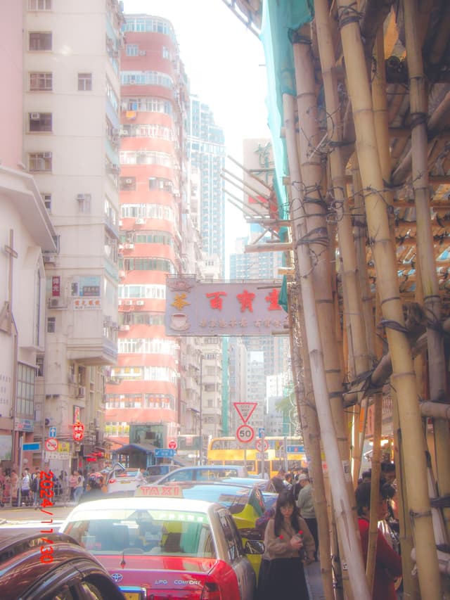 lady holding 2 cokes